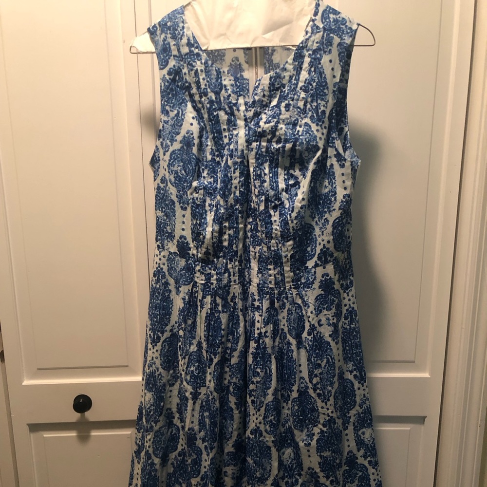 Blue print dress with detachable slip. Dress is fit and flare.
